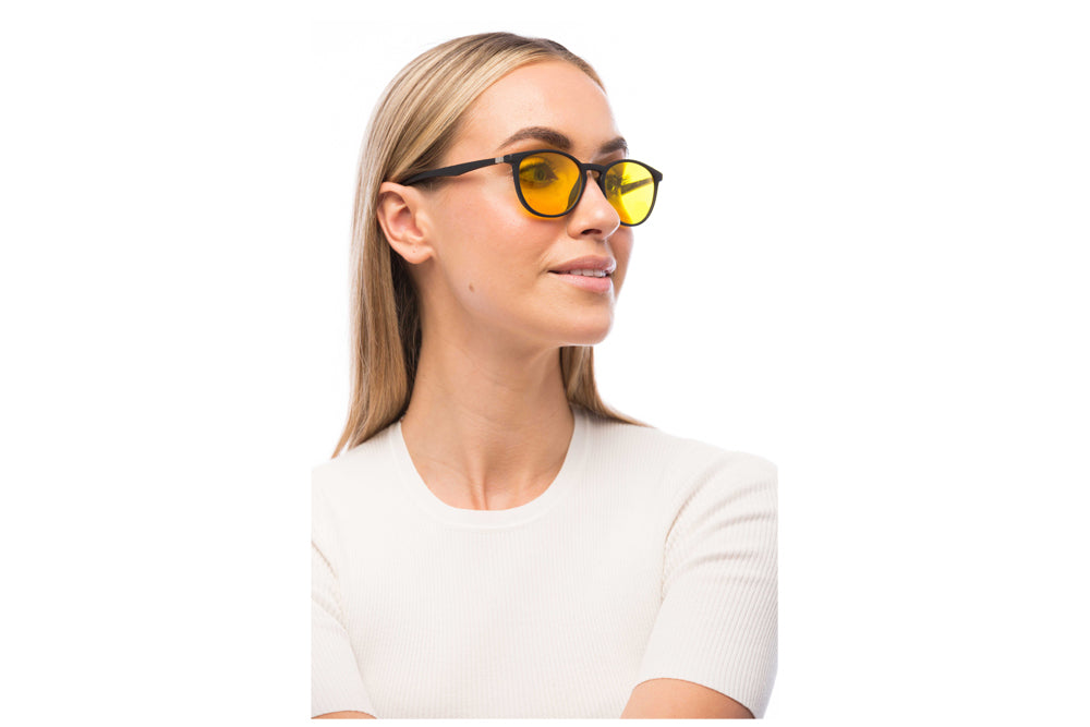 Woman Wearing Echo Light Sensitivity Glasses Readers
