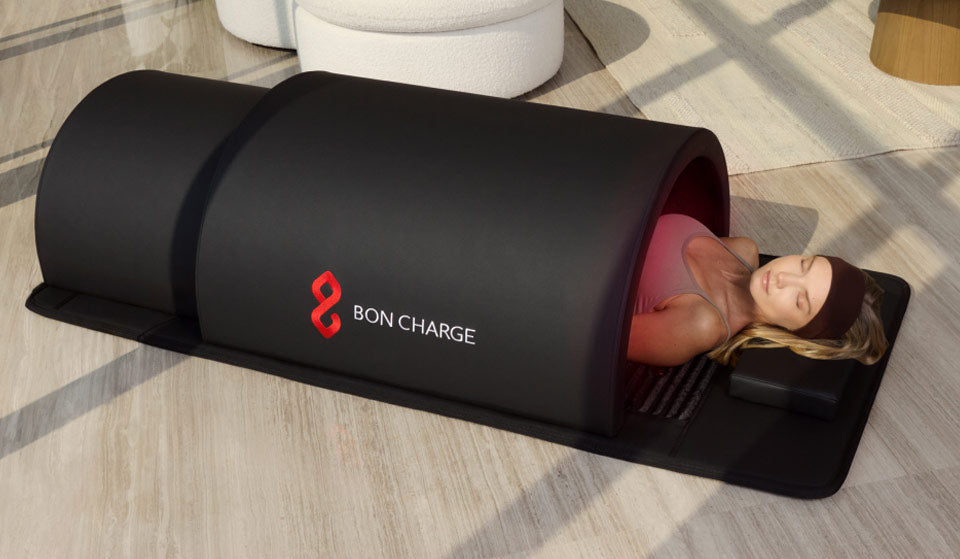 Woman Laying on PEMF Mat While Inside The Sauna Dome